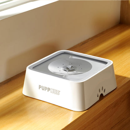 PuppHub Anti Splash Dog Bowl in white on a wooden surface, designed for mess-free drinking.