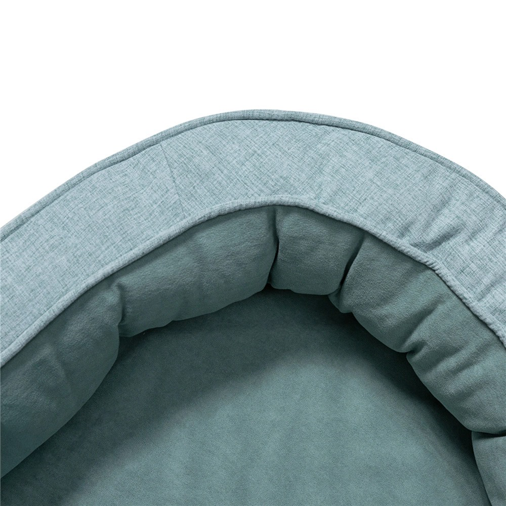 Teal oval pet bed with plush cushioning for stylish comfort