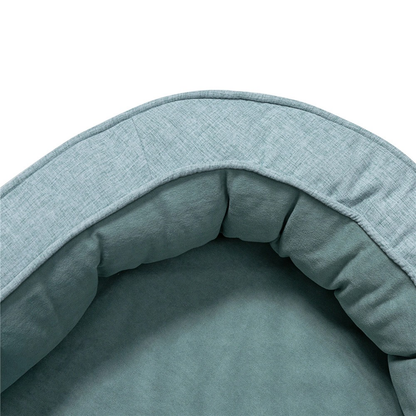 Teal oval pet bed with plush cushioning for stylish comfort