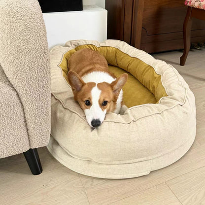 Corgi resting in a cozy beige oval dog bed with yellow interior for ultimate comfort.