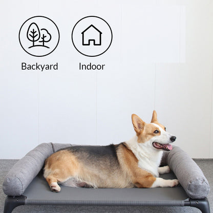 Corgi relaxing on elevated dog bed, suitable for indoor and outdoor use.