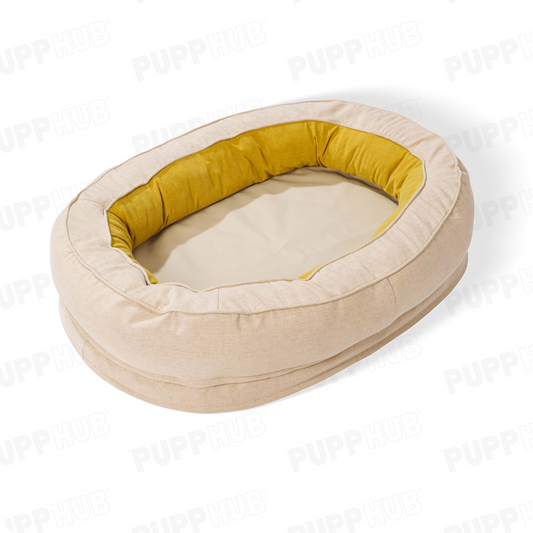 Cozy beige oval dog bed with yellow interior for ultimate pet comfort