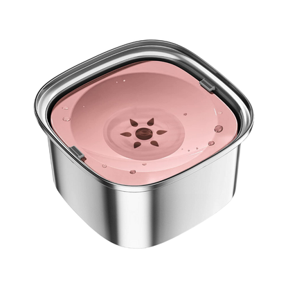 Close-up of Zero Splash stainless steel dog bowl with pink floating plate and water.