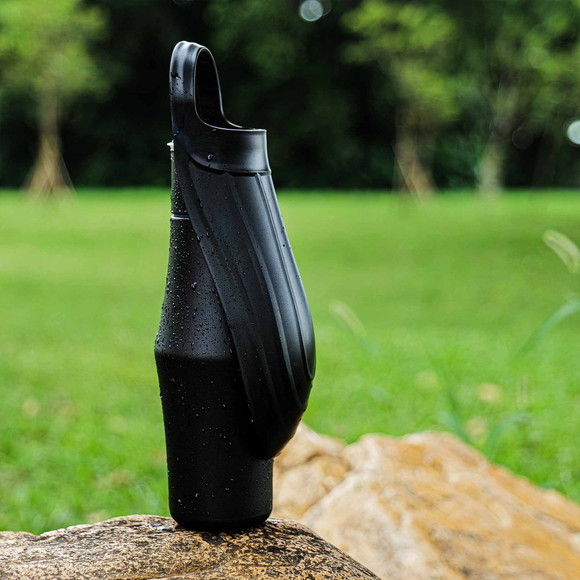 Portable black dog water bottle for on-the-go hydration outdoors