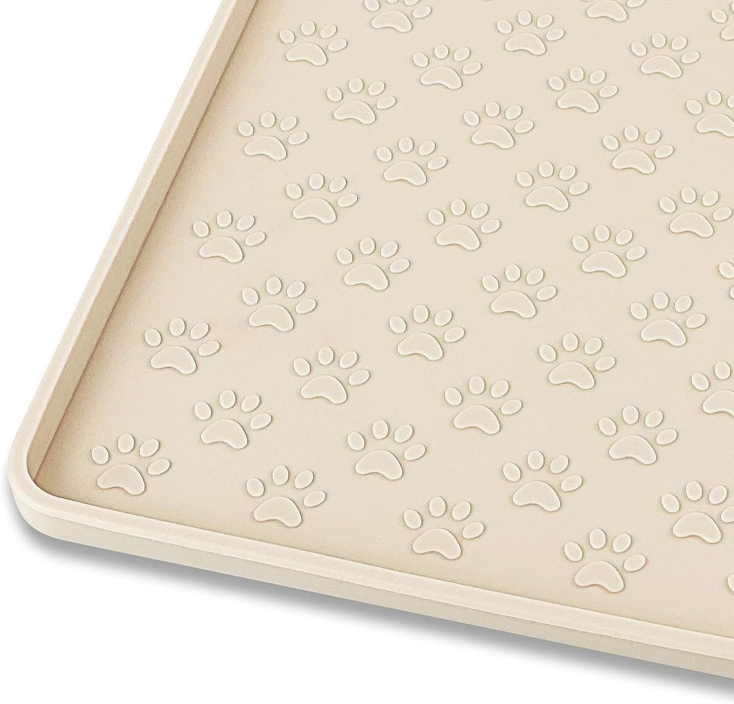 Beige silicone feeding mat with paw print texture to contain pet food messes.