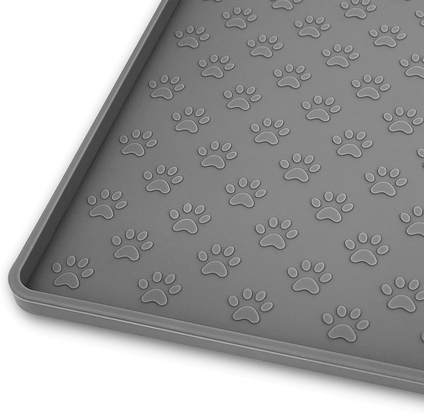 Gray silicone mat with paw print pattern, designed to contain pet food messes.