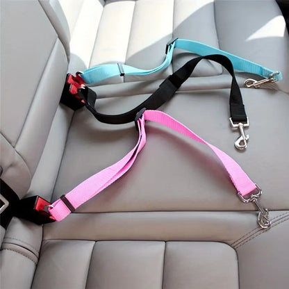 Adjustable pet safety leashes in black, pink, and blue secured in a car seat.